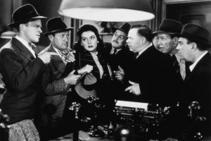 L. to R. : Frank Jenks, Roscoe Karns, Rosalind Russell, Porter Hall, Gene Lockhart, Regis Toomey & Cliff Edwards in His Girl Friday (1940)